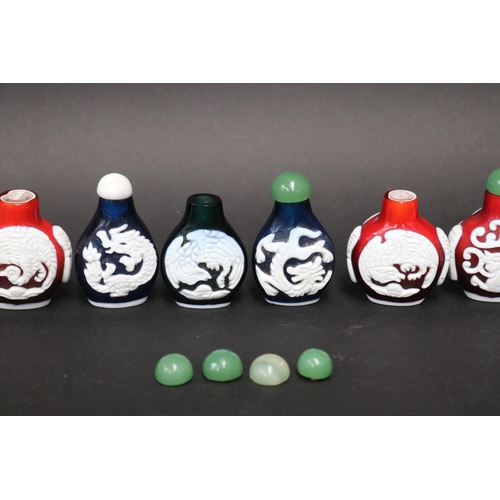 73 - Eleven Chinese Peking over lay glass snuff bottles, approx 7cm H and shorter (11)