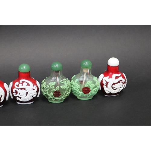 73 - Eleven Chinese Peking over lay glass snuff bottles, approx 7cm H and shorter (11)