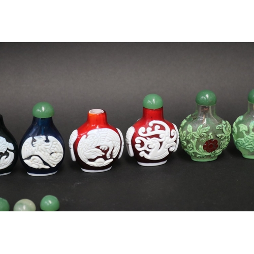 73 - Eleven Chinese Peking over lay glass snuff bottles, approx 7cm H and shorter (11)