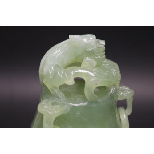 133 - Early 20th century Asian carved pale green jade lidded censer, mask head drop rings, approx 17cm H x... 