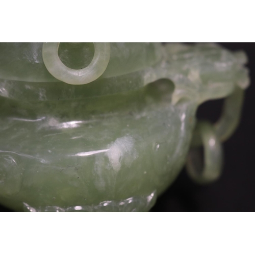 133 - Early 20th century Asian carved pale green jade lidded censer, mask head drop rings, approx 17cm H x... 