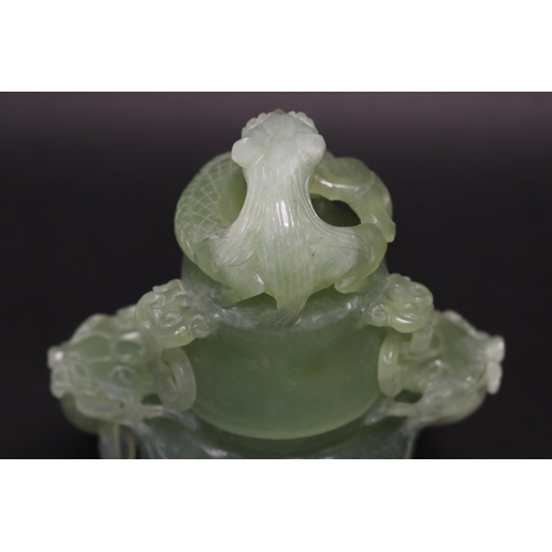 133 - Early 20th century Asian carved pale green jade lidded censer, mask head drop rings, approx 17cm H x... 