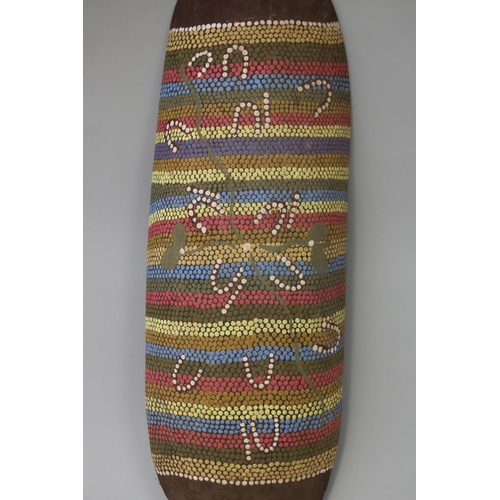 3036 - Kitty Napperby Pultara (c1924-.) Australia (Aboriginal) Painted softwood colomon 60 cm long