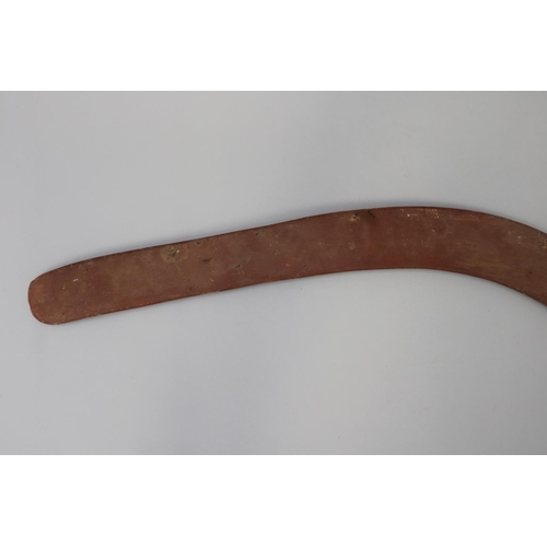 3040 - Bobby Tilmouth (1942-.) Australia (Aboriginal) Painted hardwood boomerang, 54.5 cm long
