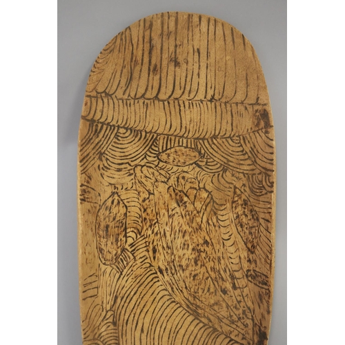 3048 - Bobby Tilmouth (1942-.) Australia (Aboriginal), pokerwork softwood coolamon, 53.5 cm long