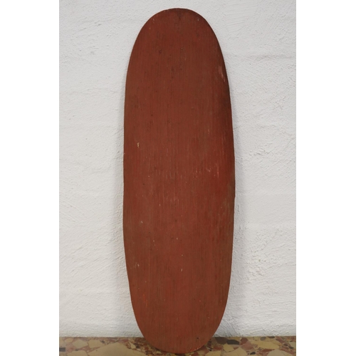 3074 - Bobby Tilmouth (1942-.) Australia (Aboriginal), large natural ocre painted fluted shield, with cut o... 