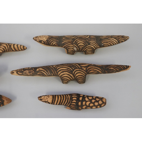 3076 - Lisa Pultara - Aboriginal-Australian (Circa 1961) Six poker work carved lizards  longest 32.5 cm (6)