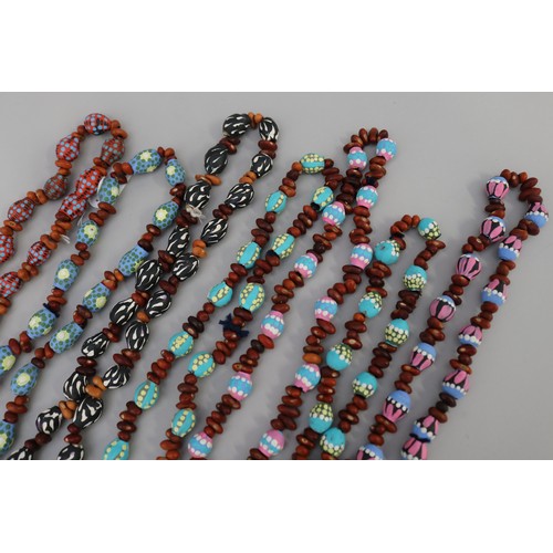 3095 - Assorted length Australian Aboriginal painted gum nut & bead necklaces, circa 1980's, Napperby stati... 