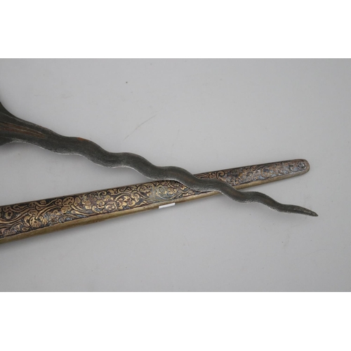 66 - Antique Kris with well carved handle set with green stone, approx 48cm L