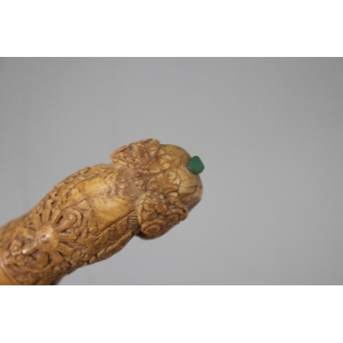 66 - Antique Kris with well carved handle set with green stone, approx 48cm L