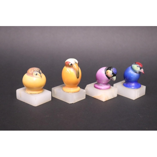 75 - Set of four Art Deco ceramic birds place settings on alabaster bases, some with damages., approx 6cm... 