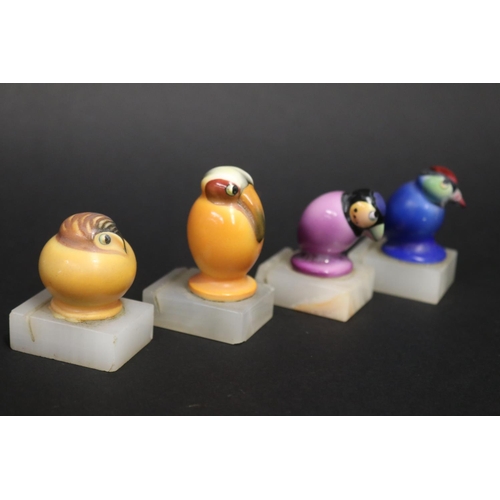 75 - Set of four Art Deco ceramic birds place settings on alabaster bases, some with damages., approx 6cm... 