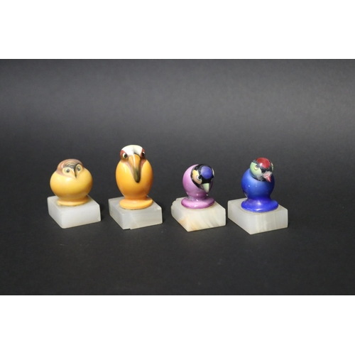 75 - Set of four Art Deco ceramic birds place settings on alabaster bases, some with damages., approx 6cm... 