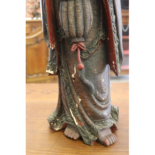 310 - Large red lacquered wood figure of Guanyin, some losses and flaking, approx 93cm H