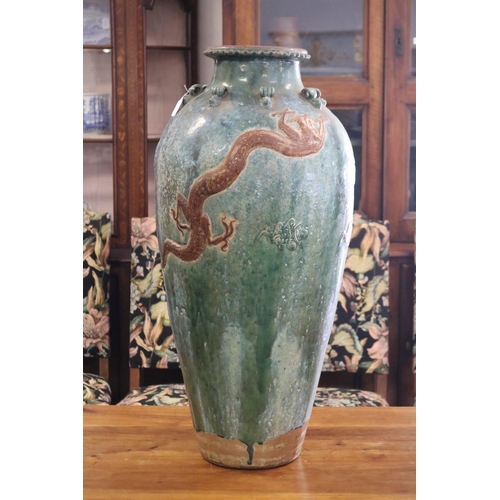 312 - Large antique mataban green glazed storage vase, with brown dragon in relief, rope lugs to the top r... 
