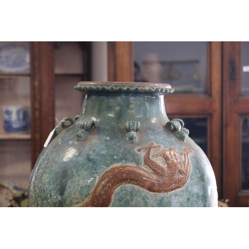 312 - Large antique mataban green glazed storage vase, with brown dragon in relief, rope lugs to the top r... 
