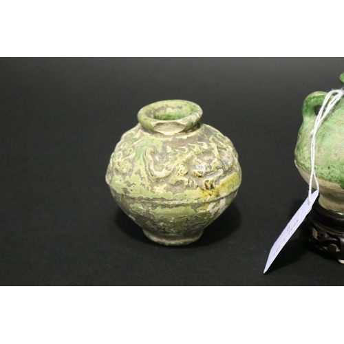 317 - Sawankhalok relief pottery jar, along with a early celadon squat jar, and green glazed song dynasty ... 