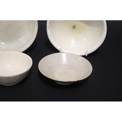 320 - Assortment of early Song dynasty cream glazed white stoneware bowls, approx 13cm Dia and smaller (6)