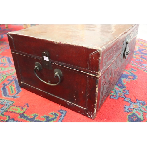 386 - Antique Chinese red lacquer trunk, approx 28cm H x 64cm W x 43cm D