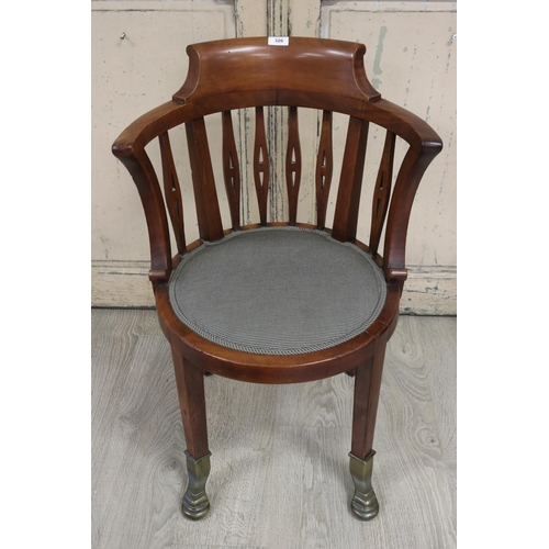 326 - Antique mahogany horse shoe shape desk arm chair, fitted to the front legs with solid brass pad feet... 