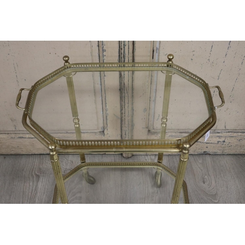 357 - Vintage brass and glass two tiered mobile trolley, approx 67cm H x 53cm W x 36cm D
