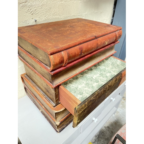 135 - Large faux stack of leather spine books, with lift up top box, and single drawer below, approx 52.5c... 