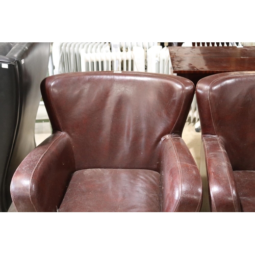 268 - Pair of brown leather tub arm chairs, A/F (2)