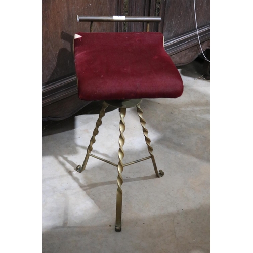 357 - Antique wrought iron based swivel piano stool, red upholstery, approx 66cm H