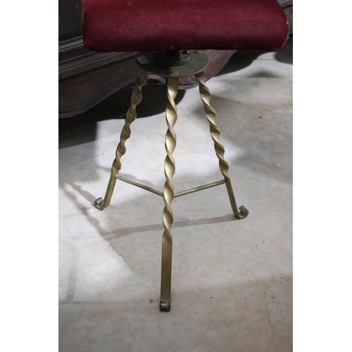 357 - Antique wrought iron based swivel piano stool, red upholstery, approx 66cm H