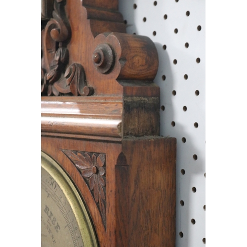 106 - Late Victorian carved oak banjo barometer, the silvered dial inscribed 'Casella, maker to the Admira... 
