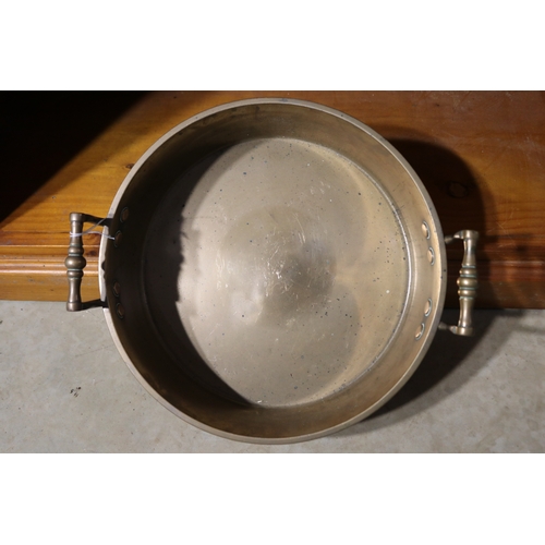 192 - Antique Early English brass twin handled pan, approx 9cm H excluding handles x 32cm Dia