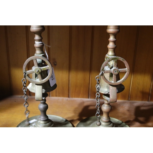 193 - Pair of antique English brass pull bell tavern candlesticks, each approx 29cm H (2)