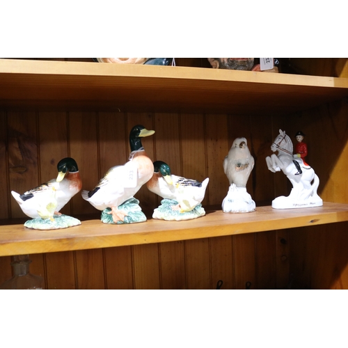 233 - Assortment of porcelain animal figures to include ducks, parrot and horse rider, approx 17cm H and s... 