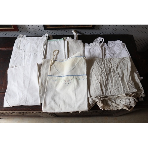 175 - Eight linen nighties or petty coats, some with intials, please note there or no measurements for thi... 