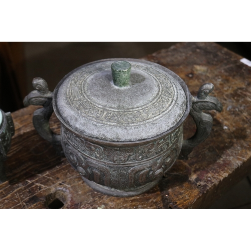 204 - Two Chinese ancient  bronze design lidded ice buckets, approx 22cm H x 35cm W and smaller (2)