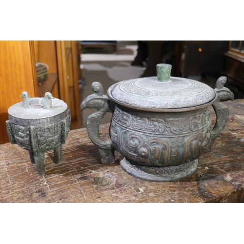 204 - Two Chinese ancient  bronze design lidded ice buckets, approx 22cm H x 35cm W and smaller (2)