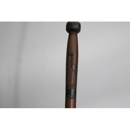 733 - Australian motif walking stick, approx 94cm L