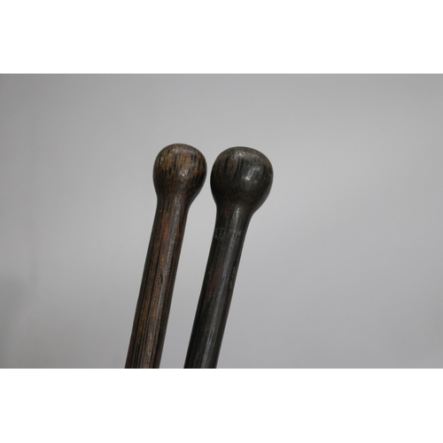 735 - Two hardwood walking sticks, approx 88cm L & shorter (2)