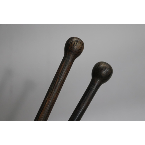 735 - Two hardwood walking sticks, approx 88cm L & shorter (2)