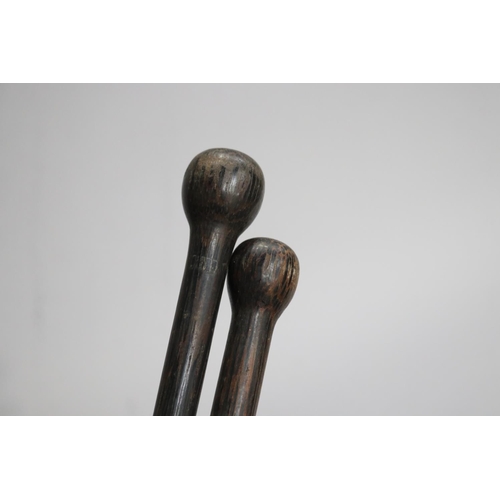 735 - Two hardwood walking sticks, approx 88cm L & shorter (2)