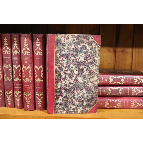 256 - Seventeen editions of antique French red leather spines, marbled end  board, by J F Cooper Paris,  d... 