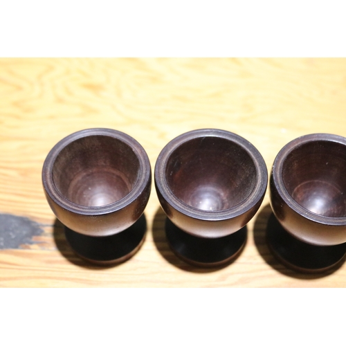 726 - Set of six turned solid wood eggs cups (6)