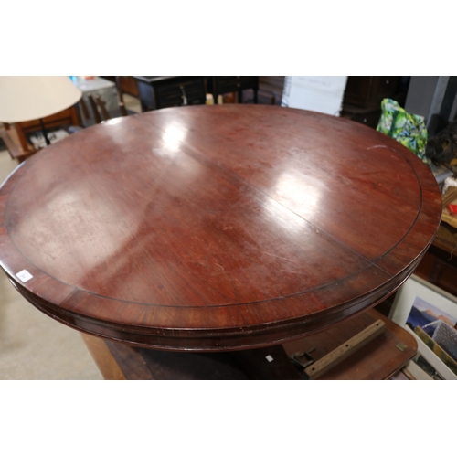 304 - Antique ebony strung cedar circular snap top dining table, sectional support, on tri form base appro... 