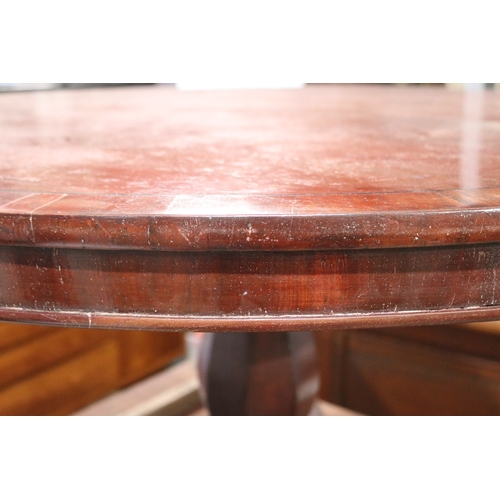 304 - Antique ebony strung cedar circular snap top dining table, sectional support, on tri form base appro... 