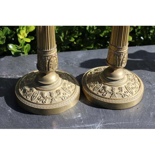 712 - Pair of antique French Empire brass candlesticks, each approx 26cm H (2)