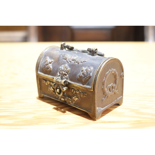 714 - Antique cast bronze domed top miniature casket, with carry handle to top, approx 7cm H (excluding ha... 