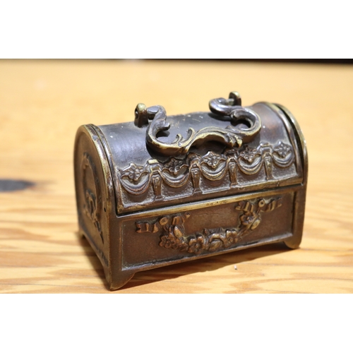 714 - Antique cast bronze domed top miniature casket, with carry handle to top, approx 7cm H (excluding ha... 