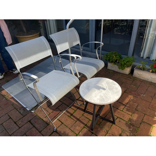 813 - Pair of folding mesh and iron patio chairs along with a modern marble topped table (3)