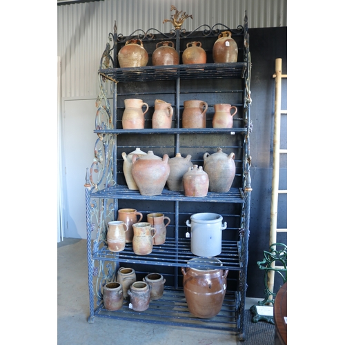 Impressive iron tiered bakers rack, with applied bunches of grapes and