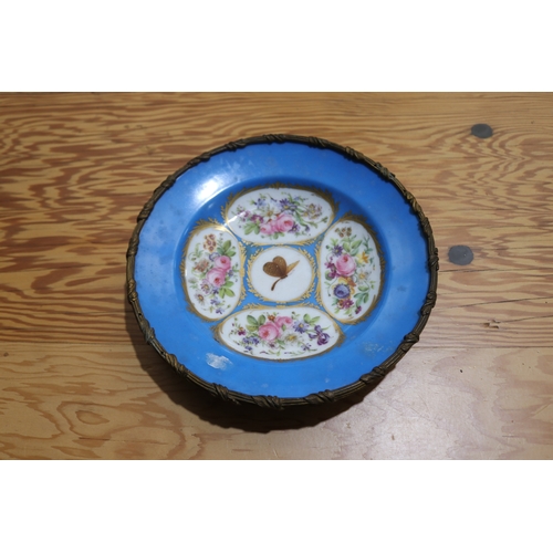 787 - Antique French blue ground plate with floral cartouches and a butterfly to centre, with bronze mount... 